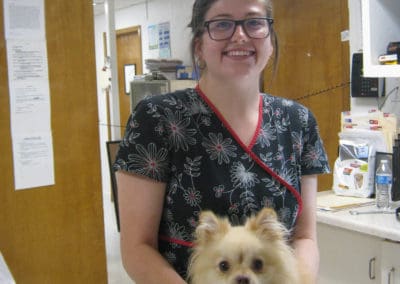 Eighth Street Animal Hospital vet tech with small dog